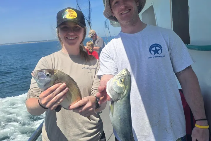 a person holding a fish
