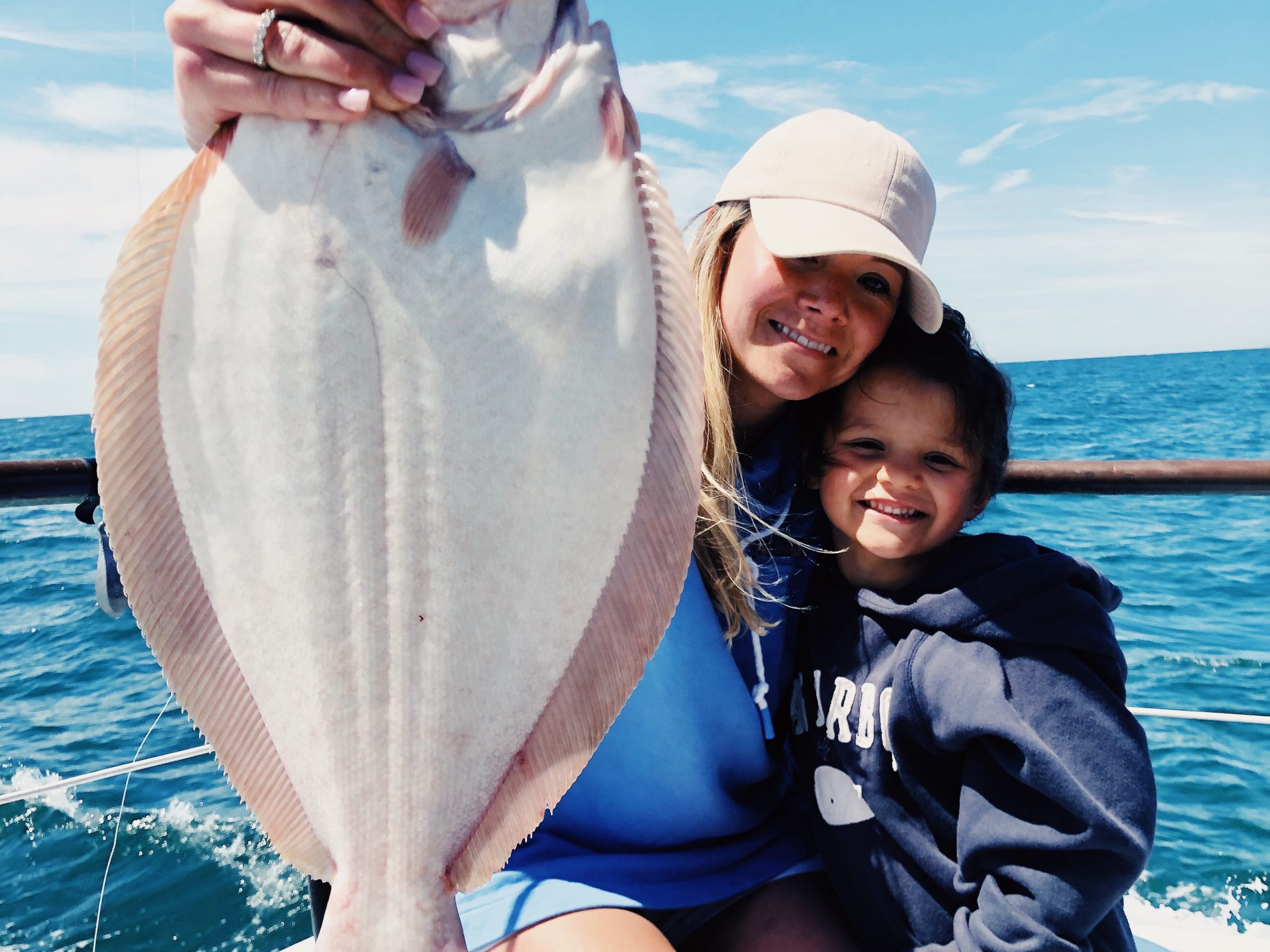 a person standing next to a body of water