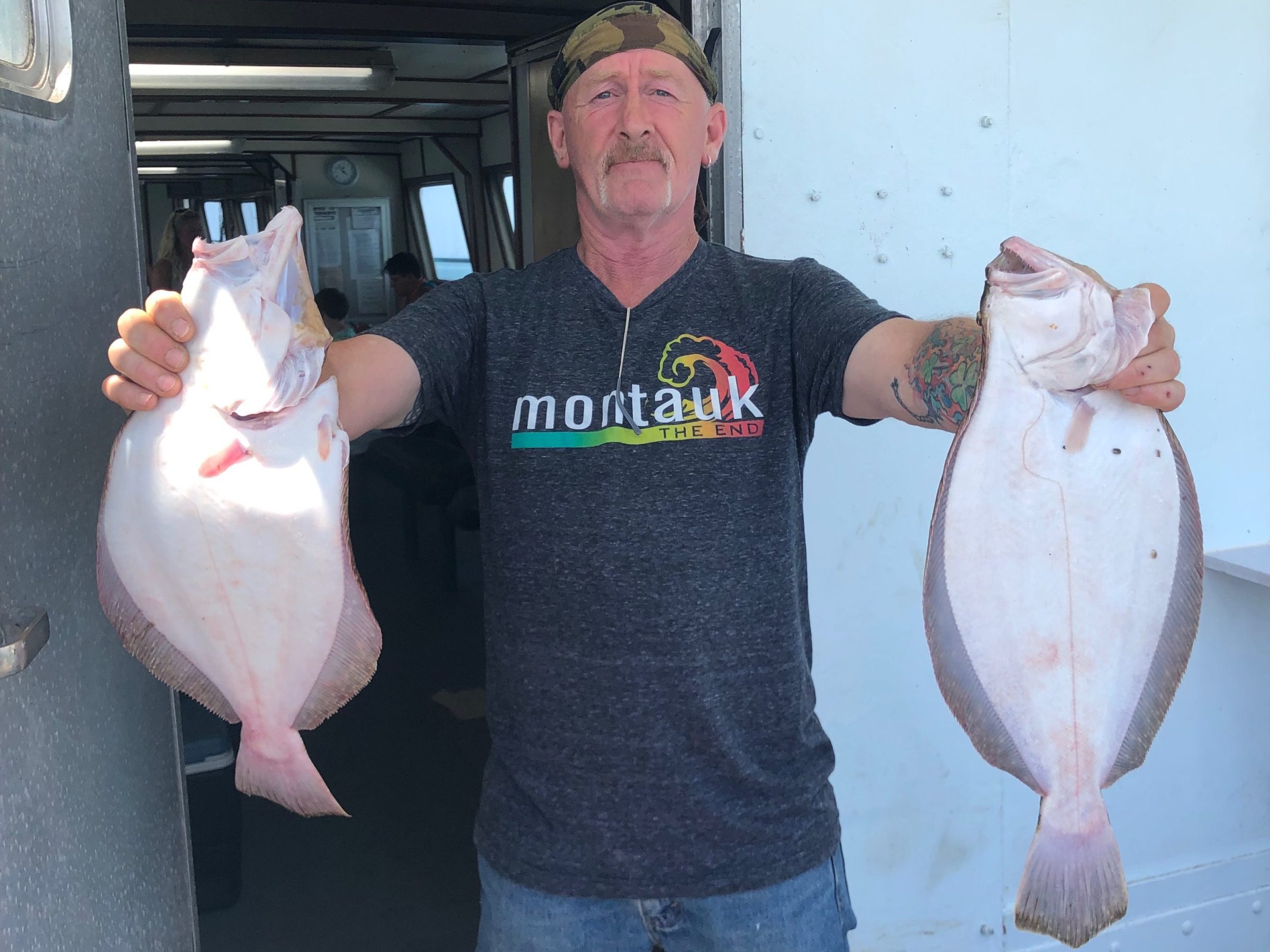 a person holding a fish