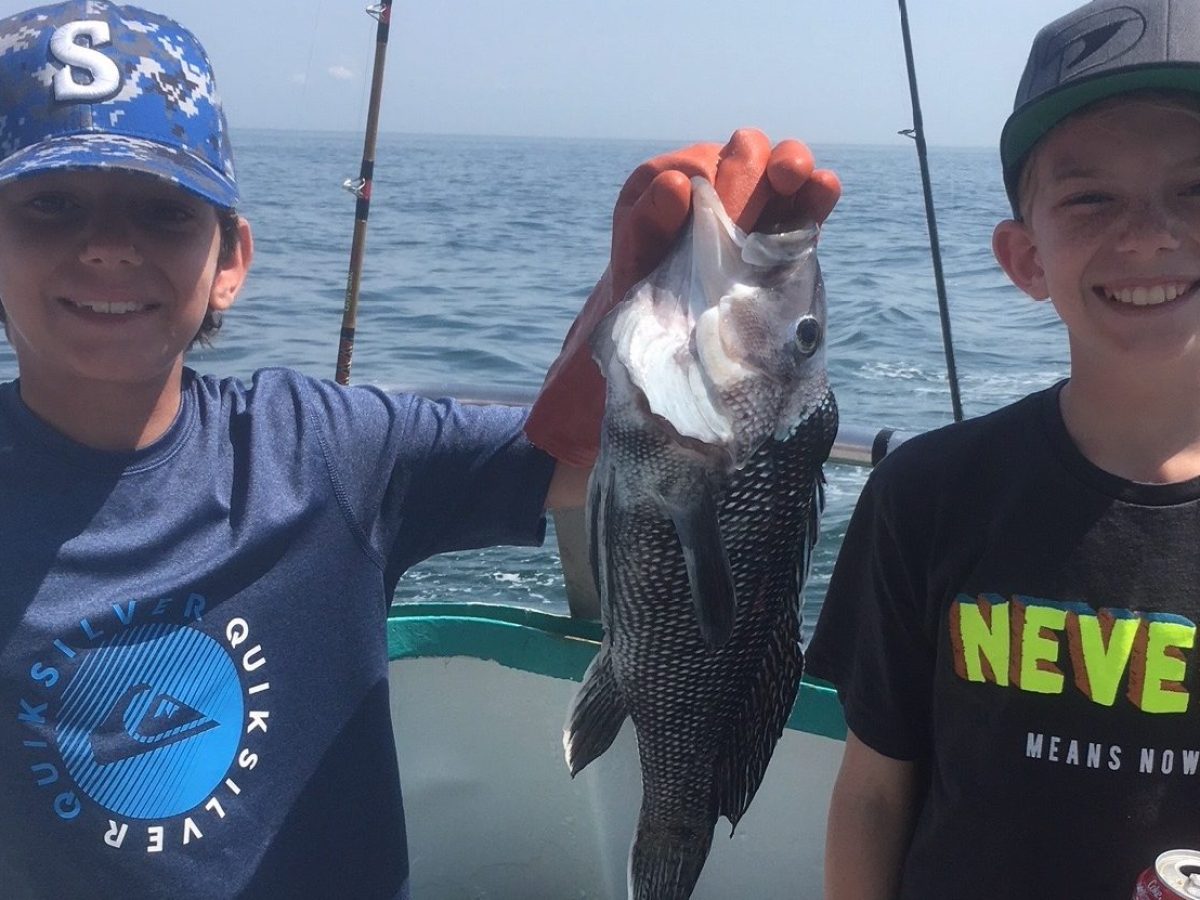 a person holding a fish