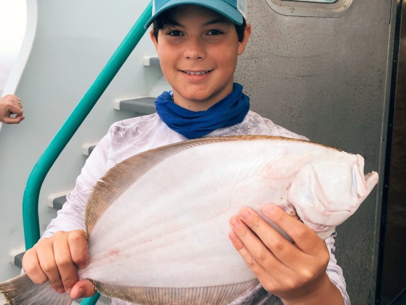 a person holding a fish
