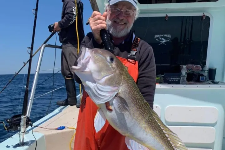 a man holding a fish