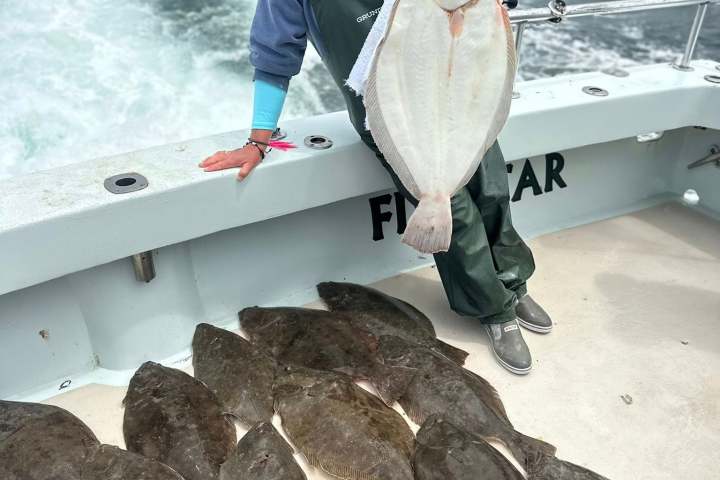 a man standing on a boat in the water