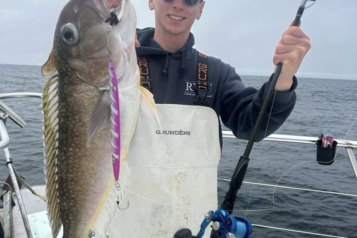 a person holding a fish