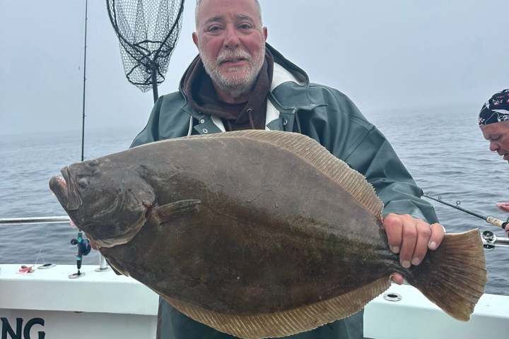 a man holding a glass of water