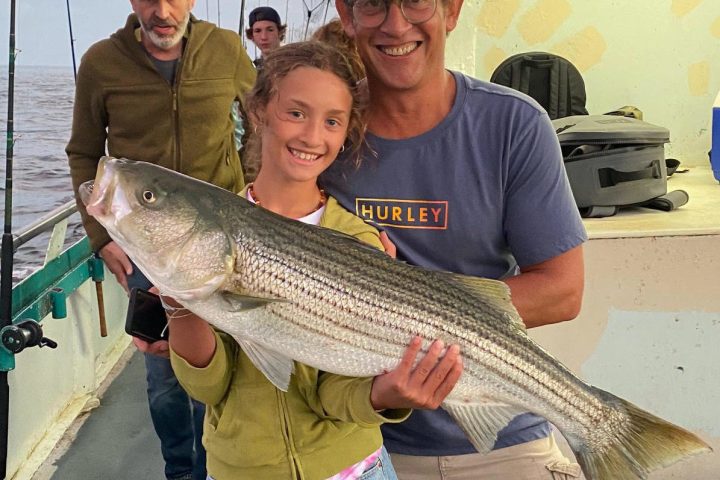 a man holding a fish