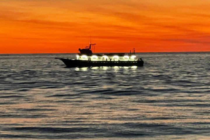 a small boat in a large body of water