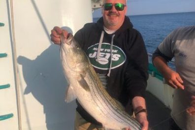 a man holding a fish