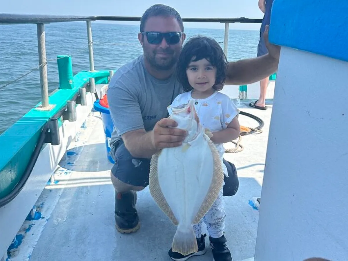 a person sitting on a boat in the water