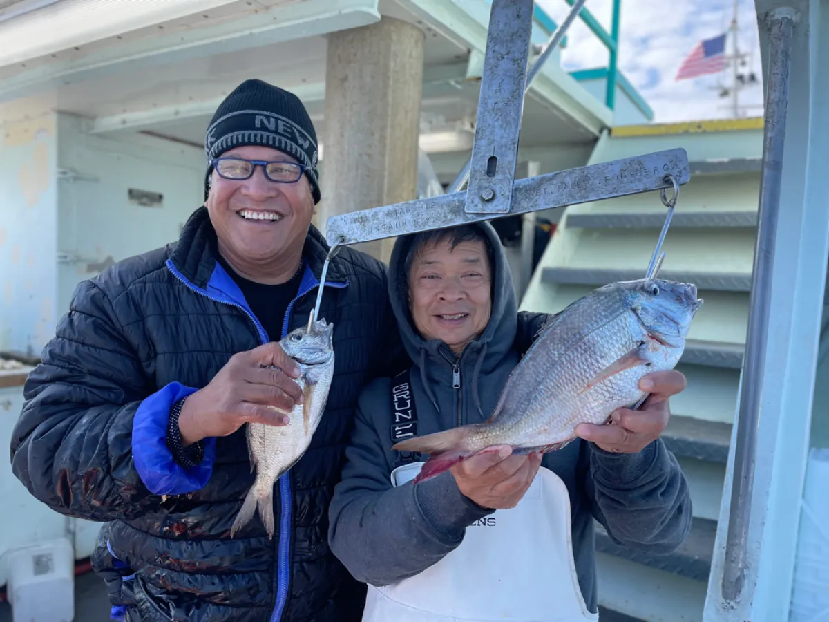 Salahuddin of Selangor holding a fish