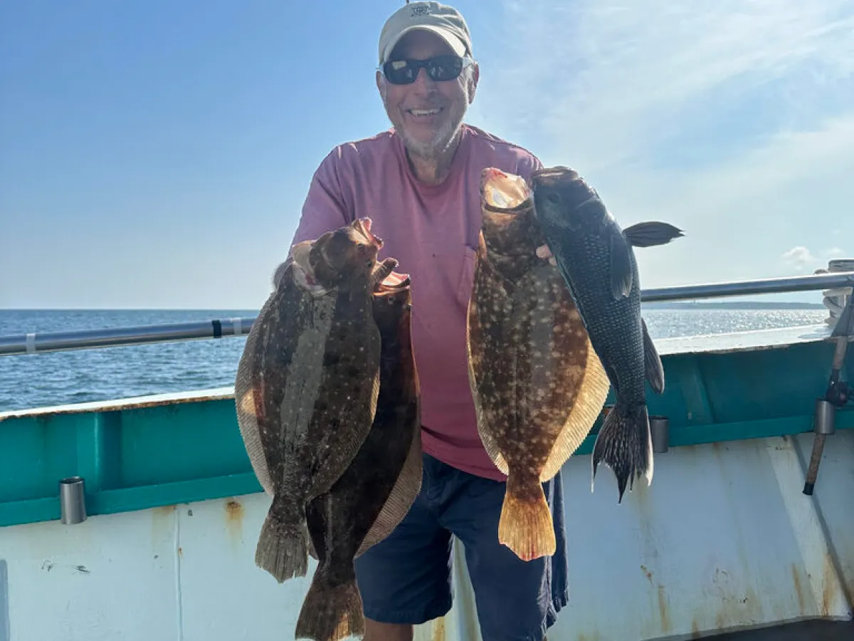 a man holding a fish