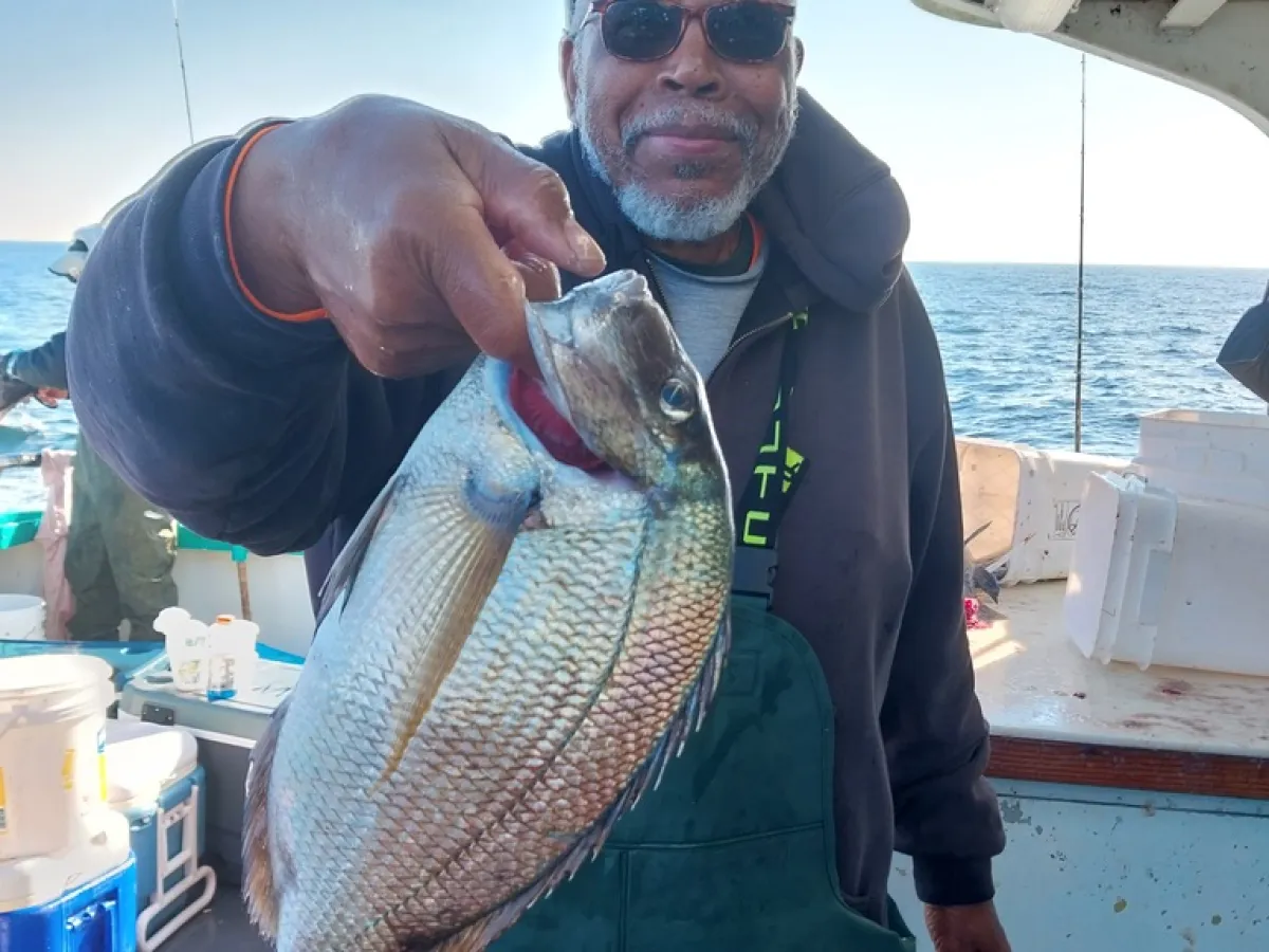 a man holding a fish