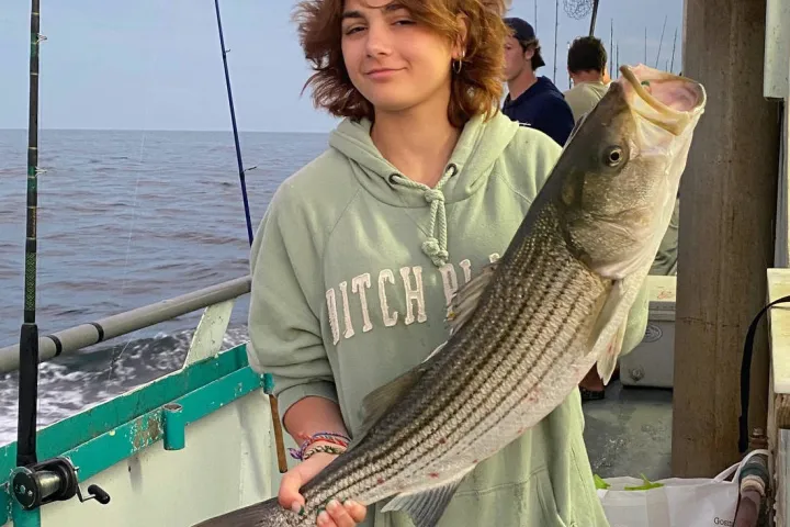 a person holding a fish