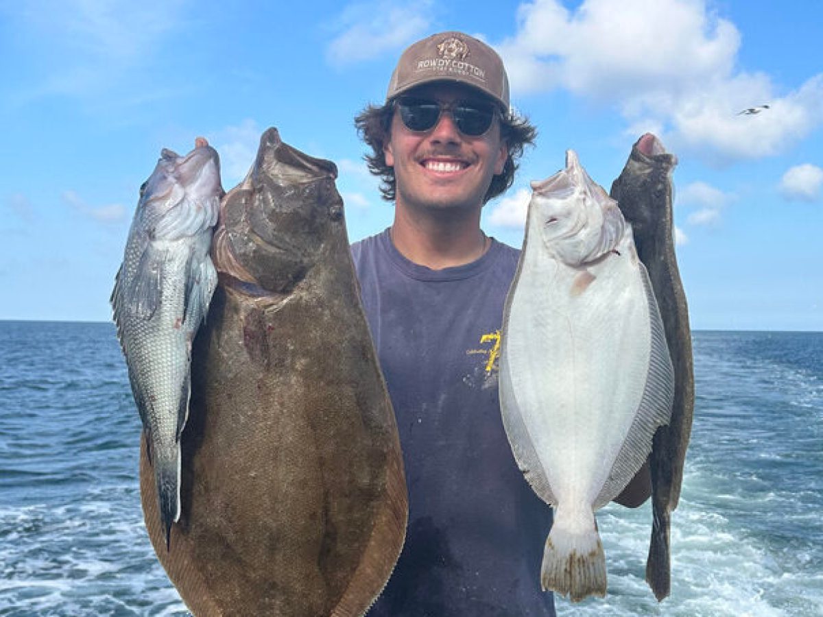 a person holding a fish in the water