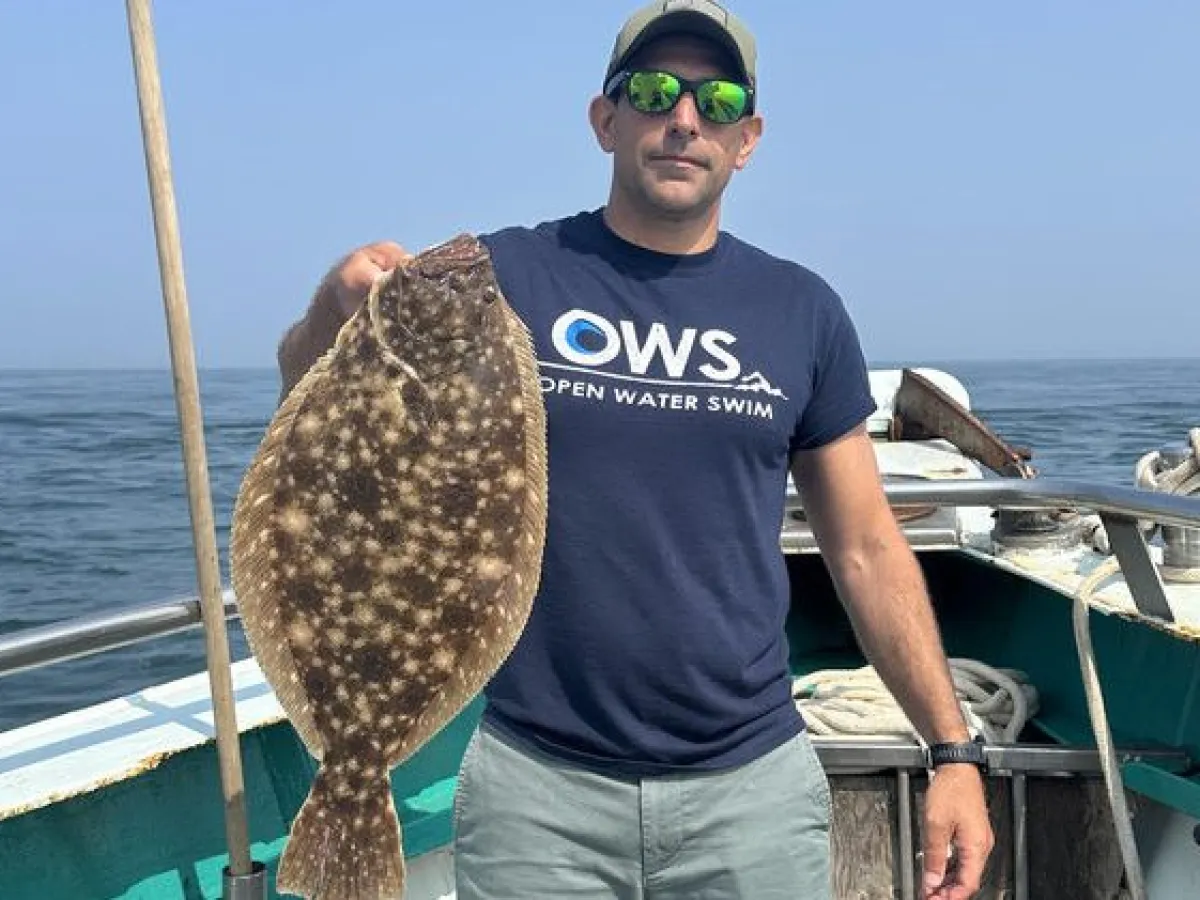 a man riding on the back of a boat