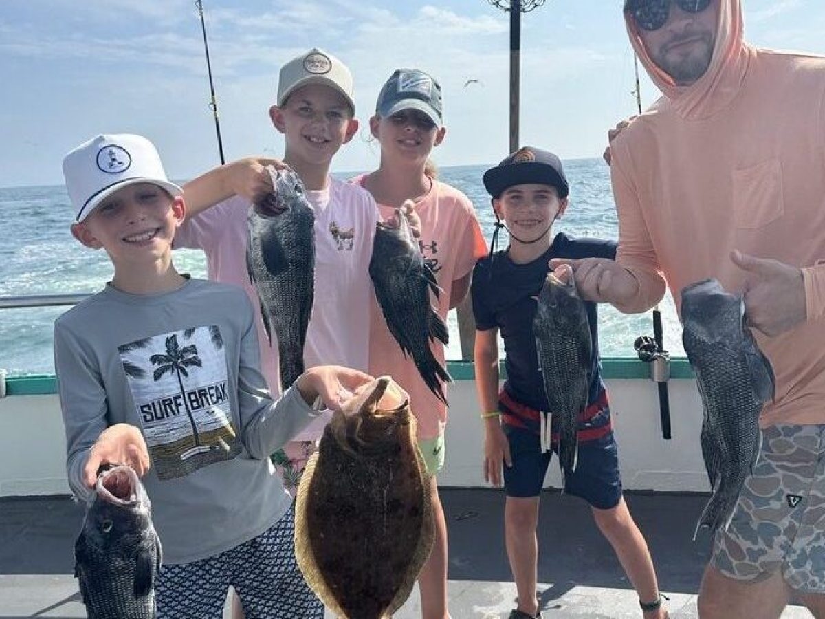 a group of people standing in a parking lot