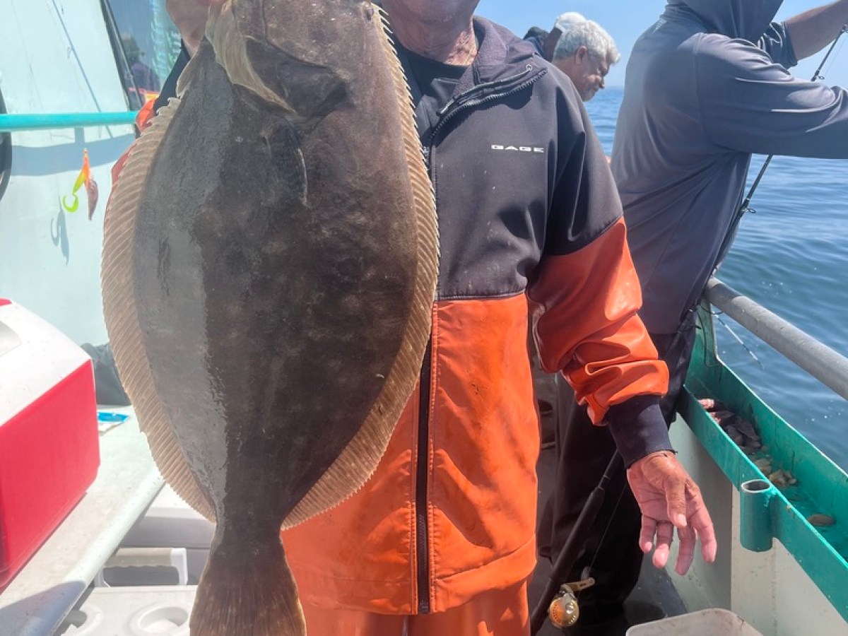 Kalu Rinpoche holding a fish