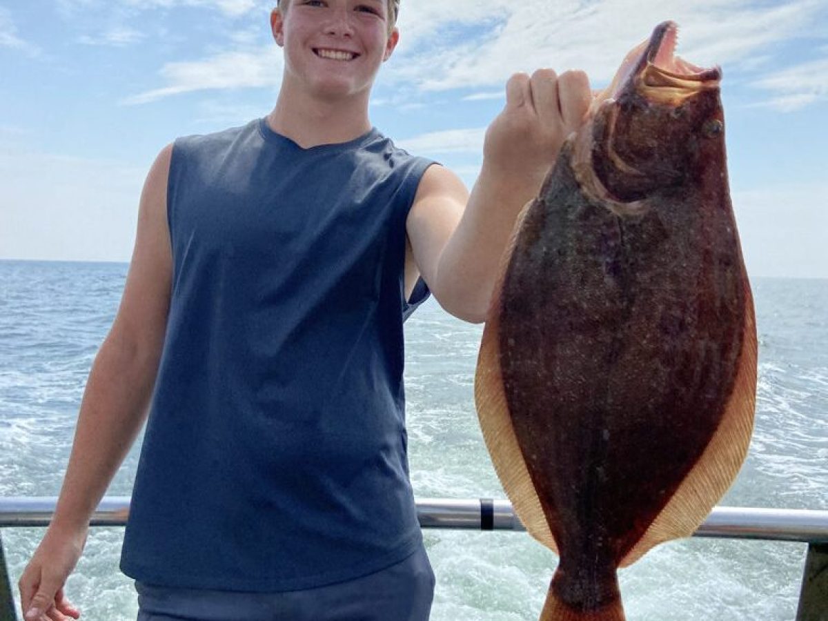 a person holding a fish