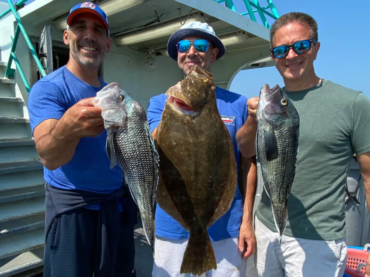 a man holding a fish