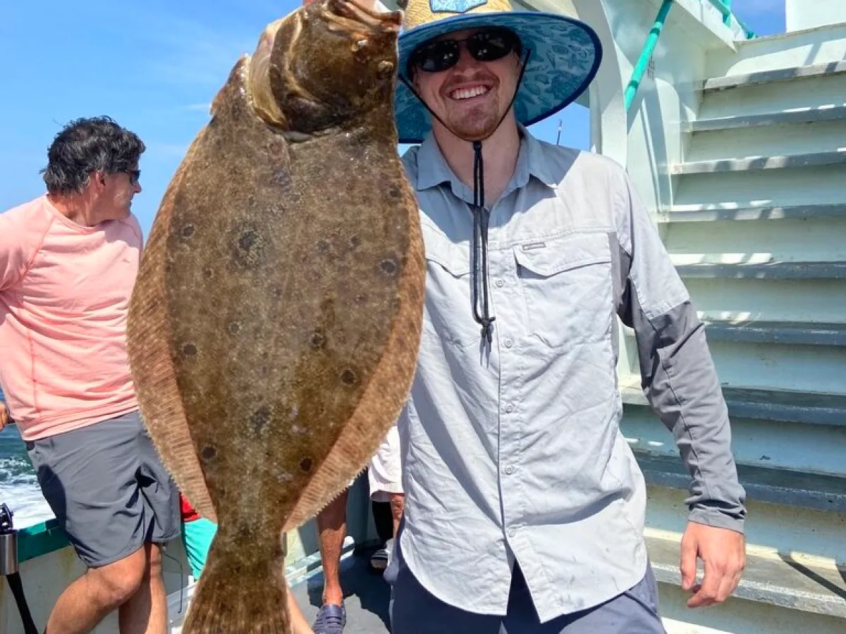 a man holding a fish
