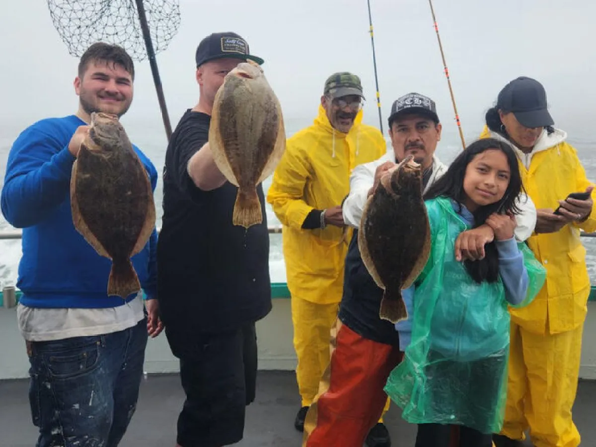 a group of people that are standing in the water