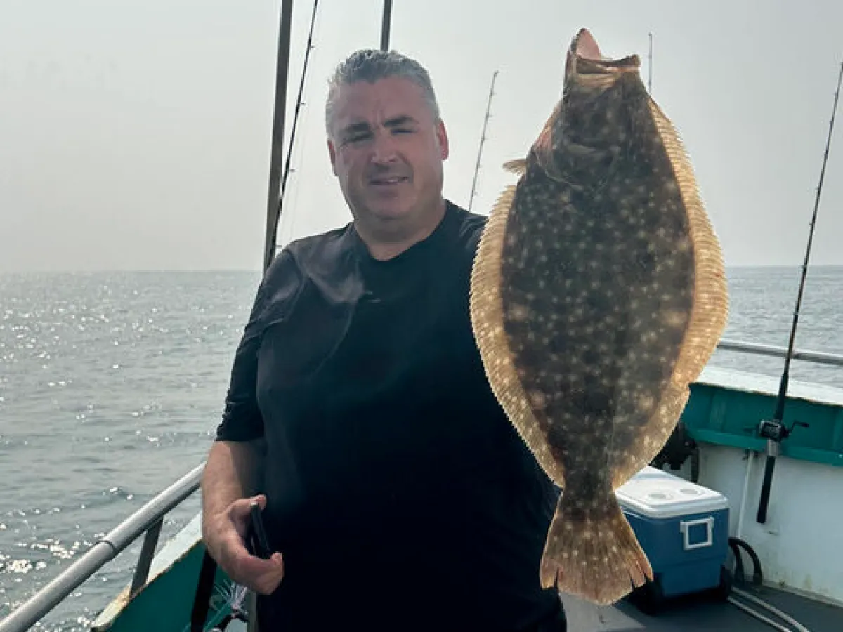 a person standing on a boat in the water