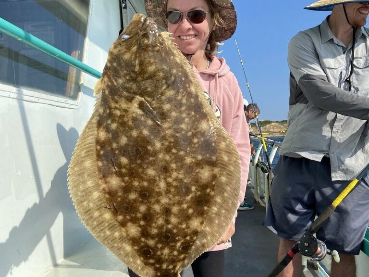 a man and a woman standing in front of a building
