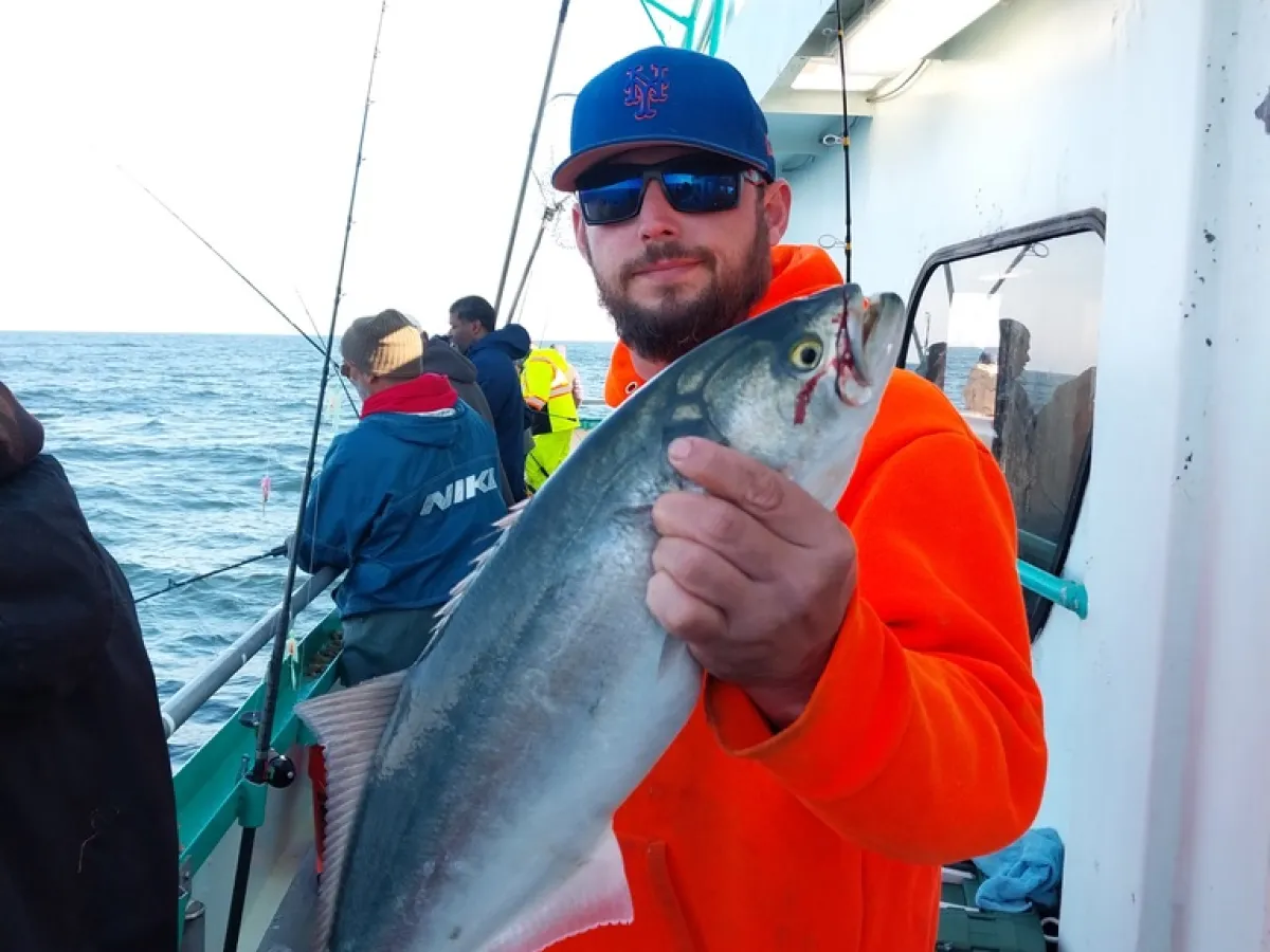 a person holding a fish