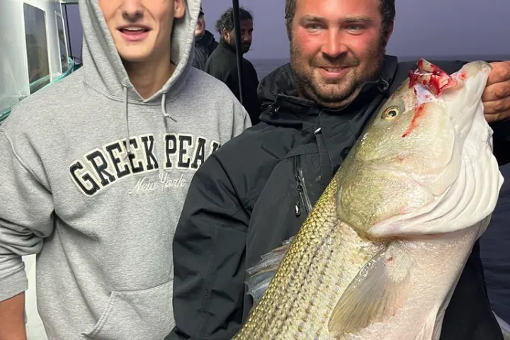 a person holding a fish