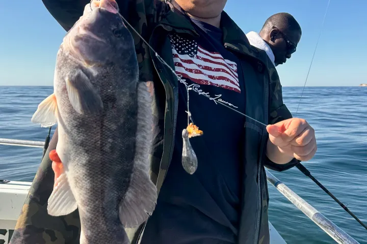 Tsai Chi-chang holding a fish