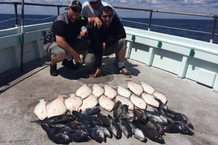 a person sitting on a bench near the water