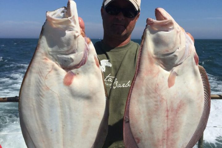 a man holding a fish
