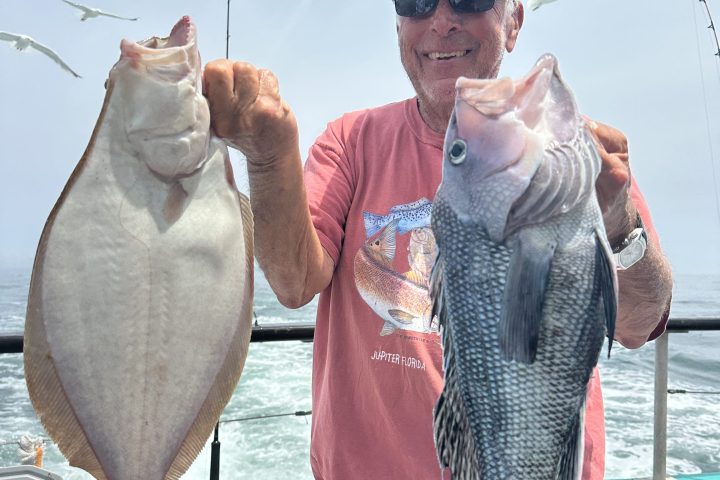 a person holding a fish