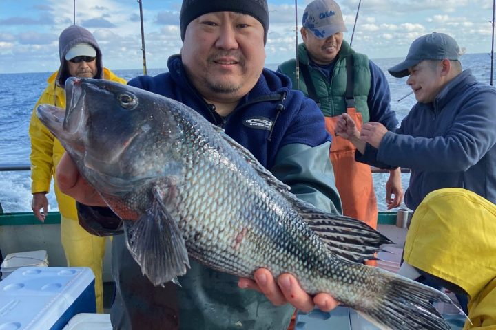 a person holding a fish