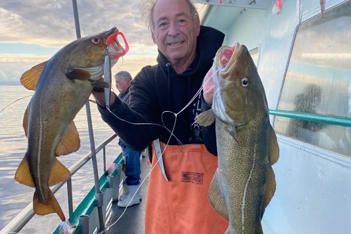 a person holding a fish