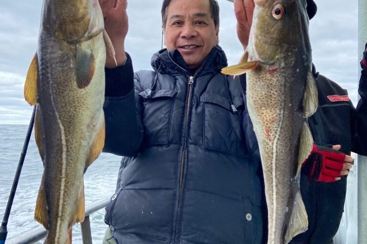 a person holding a fish