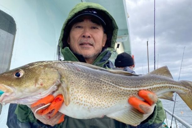 Kiyoshiro Imawano holding a fish