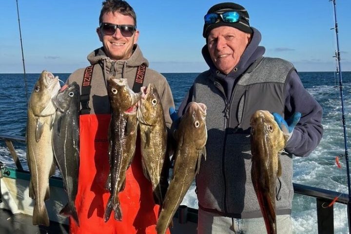 a person holding a fish