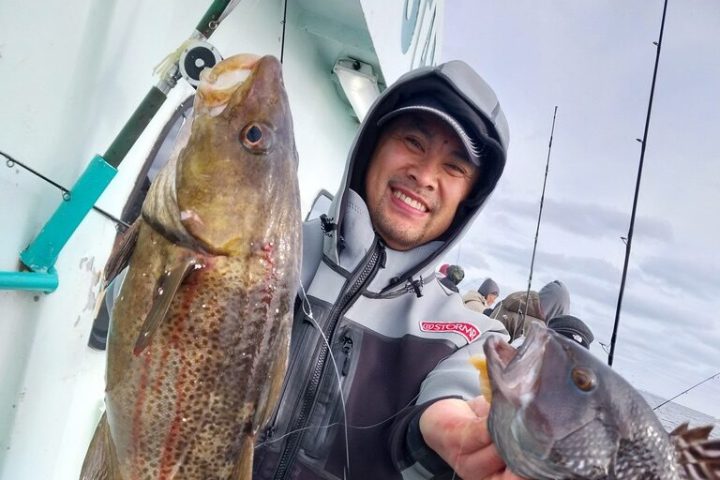 a person holding a fish