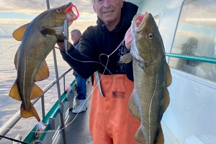 a person holding a fish