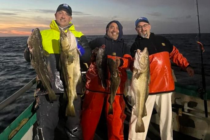 a group of people posing for the camera