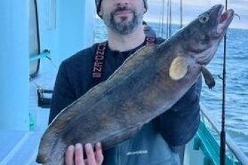 a person holding a fish