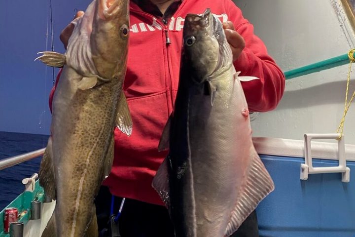 a person holding a fish