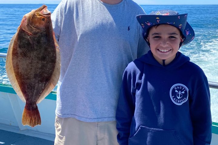 a man holding a fish