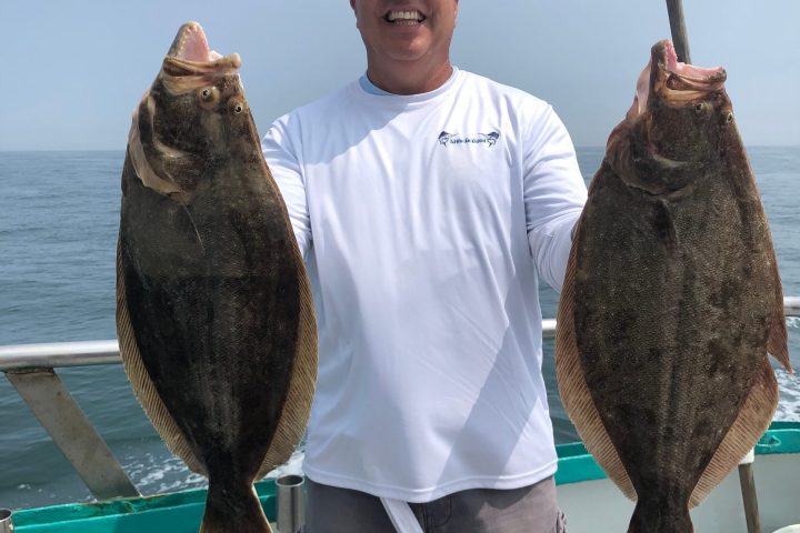 a person holding a fish