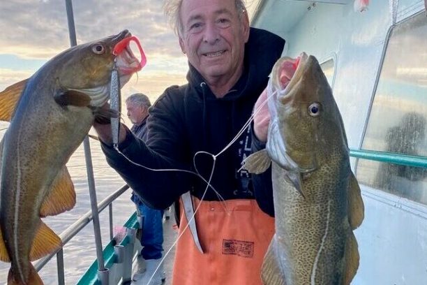 a person holding a fish