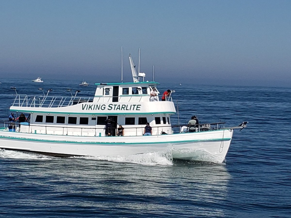 a small boat in a large body of water