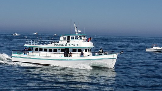 a small boat in a large body of water