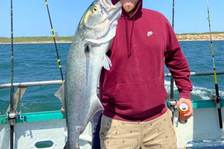 a man holding a fish