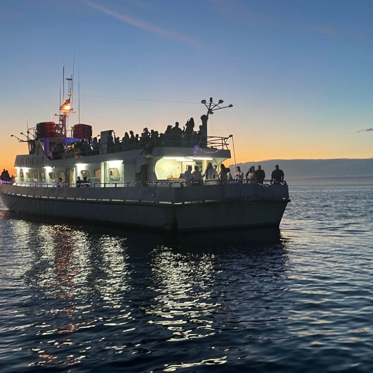 a small boat in a large body of water